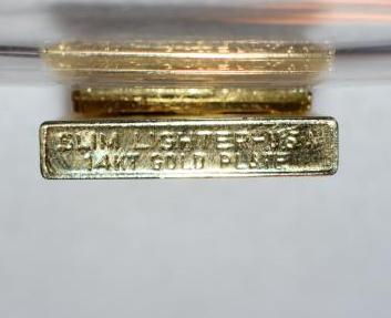 Grouping: Bausch & Lomb Magnifier on legs, Belt Buckle, 14Kt Gold Plate Lighter, vintage