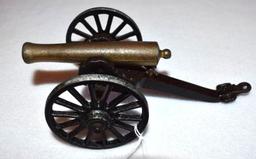 Vintage Cast Iron Toy Cannon with brass barrel, can shoot, 8 in overall