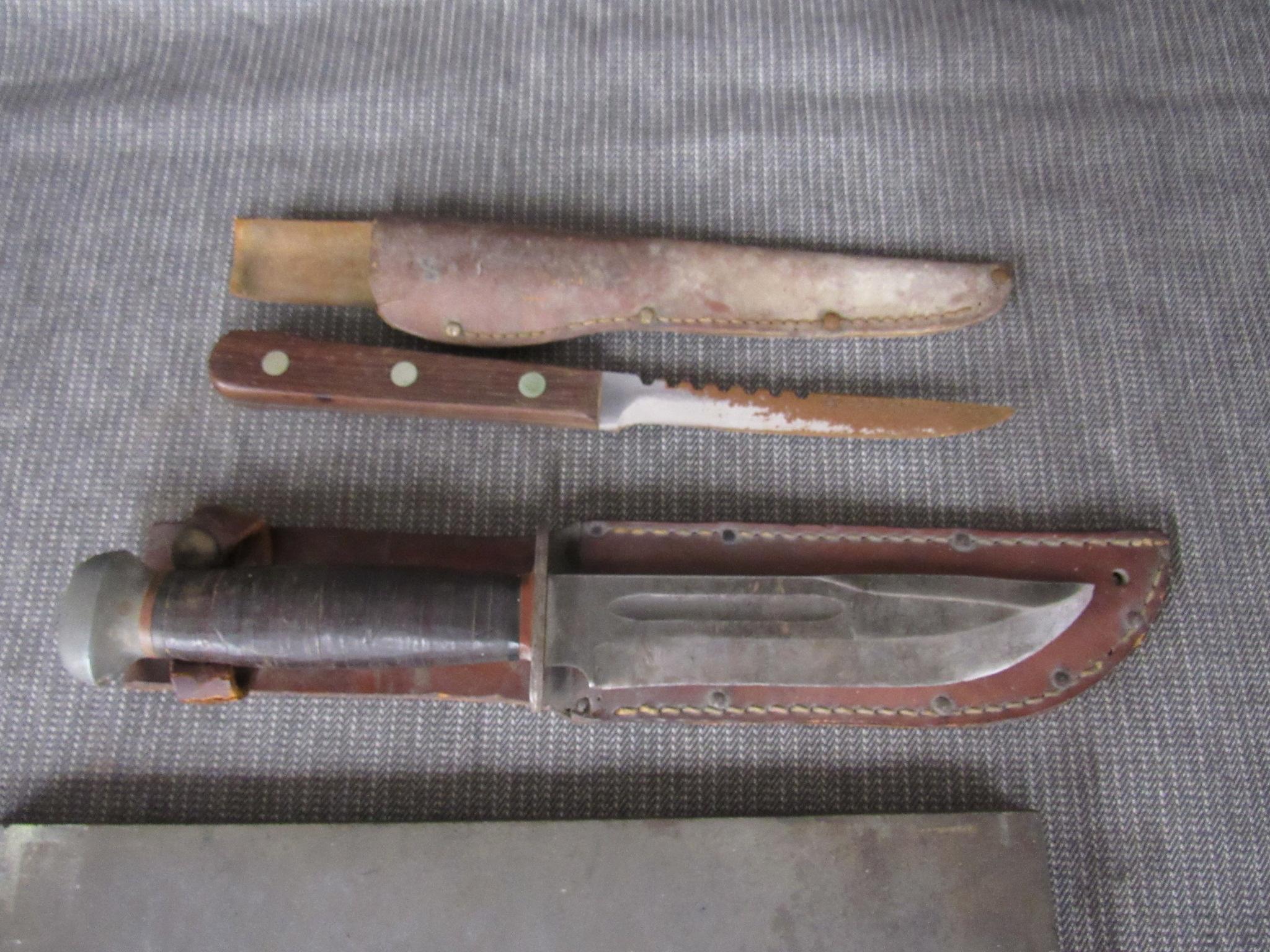 3 fixed blade knives and a sharpening stone.