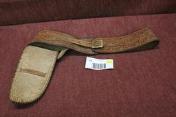 Elaborate leather holster and belt.