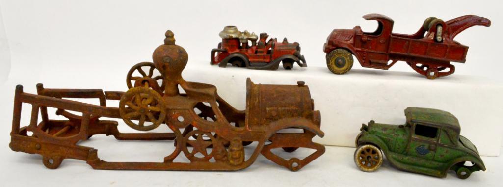 Group of four antique cast iron toy vehicles for parts or repairs