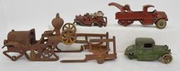 Group of four antique cast iron toy vehicles for parts or repairs