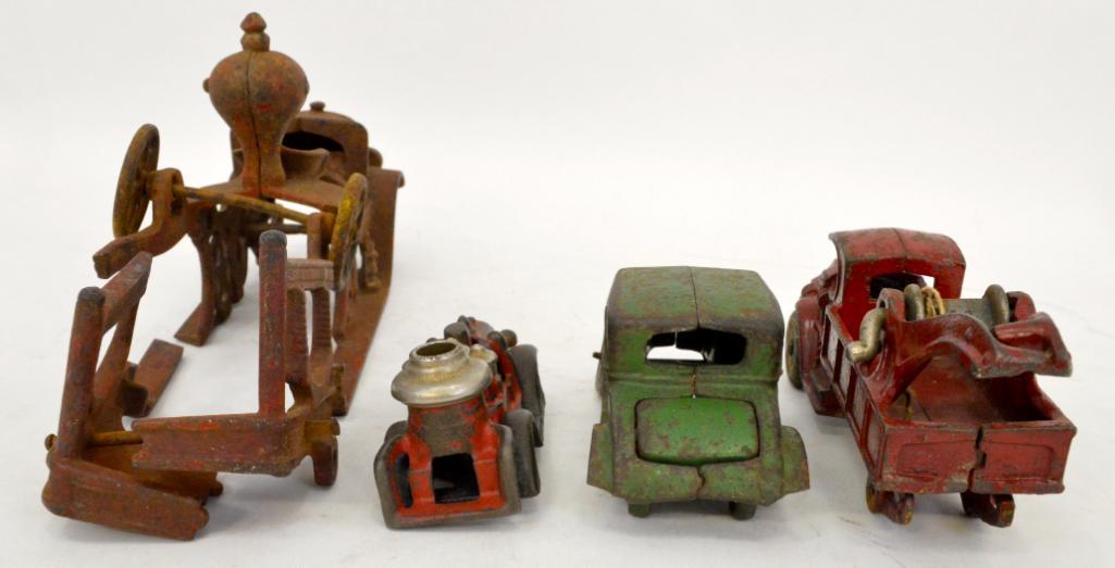 Group of four antique cast iron toy vehicles for parts or repairs