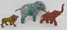 Vintage cast iron / aluminum elephants and lion one is a bank