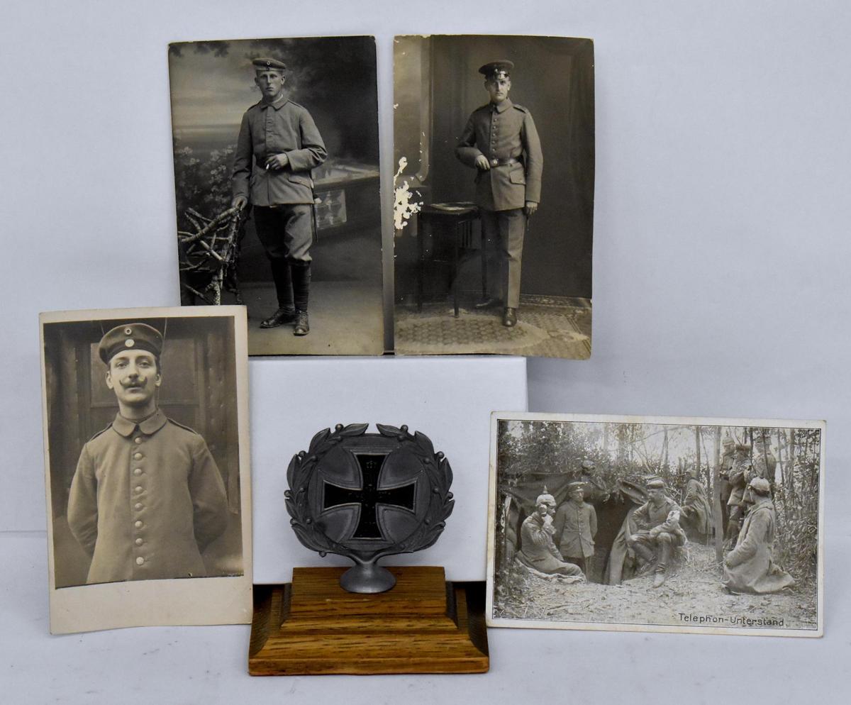 Grouping of four WWI German postcards plus Iron Cross Desk Ornament