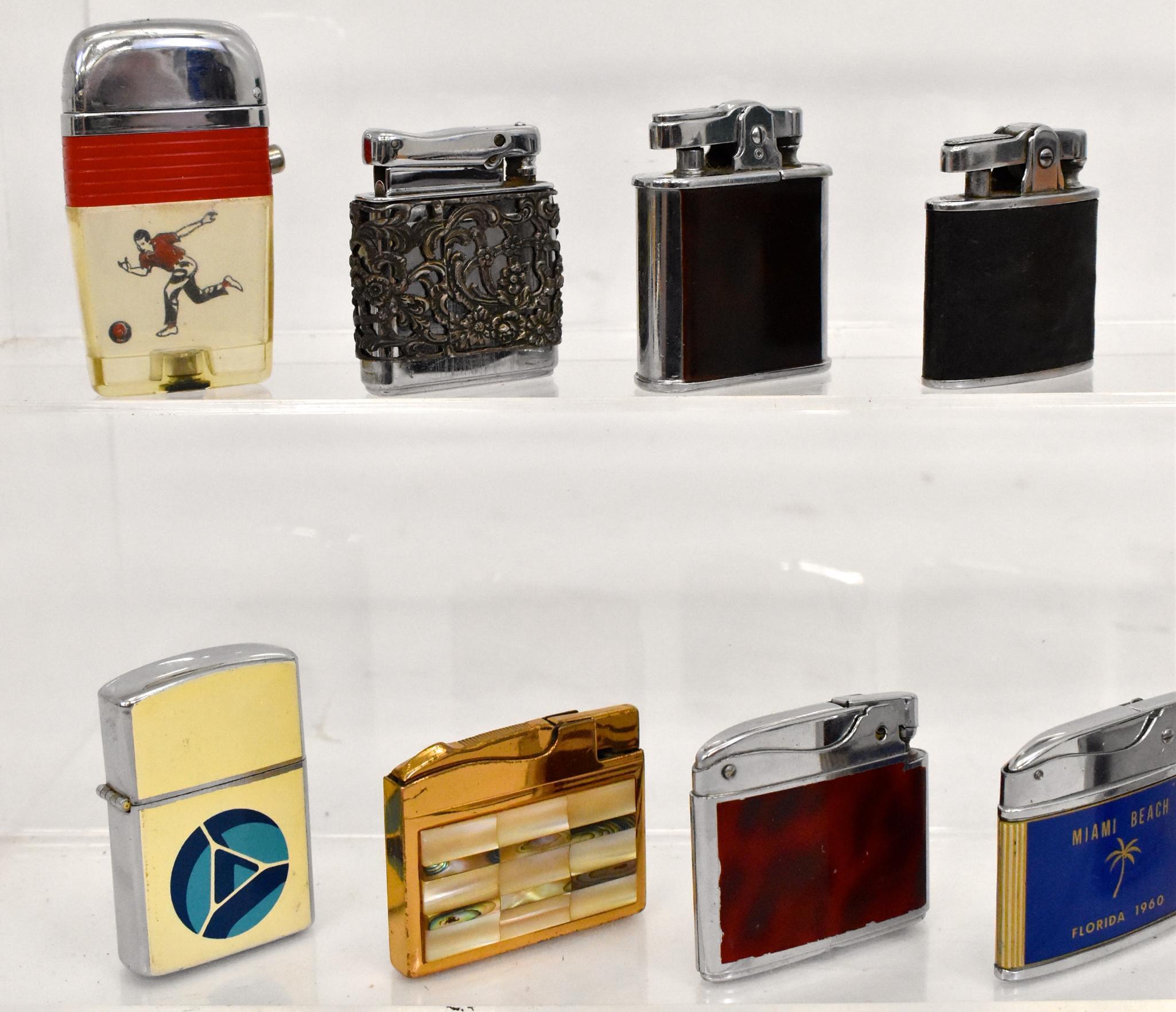 One dozen vintage cigarette lighters