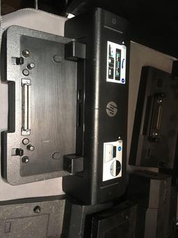 Four Dell Docking Stations With HP Docking Station