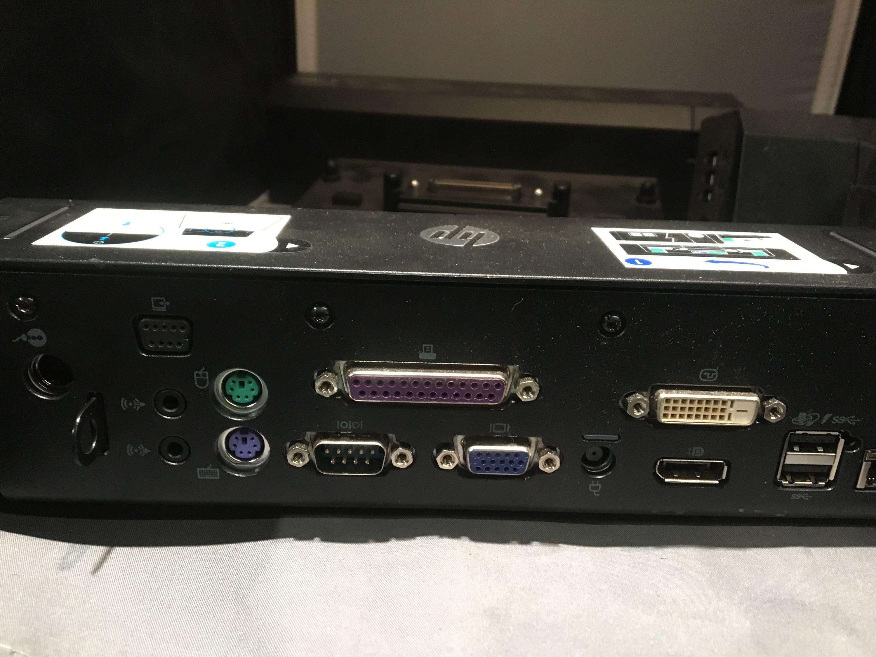 Four Dell Docking Stations With HP Docking Station