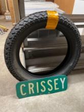 New Motorcycle Tire and Street Sign