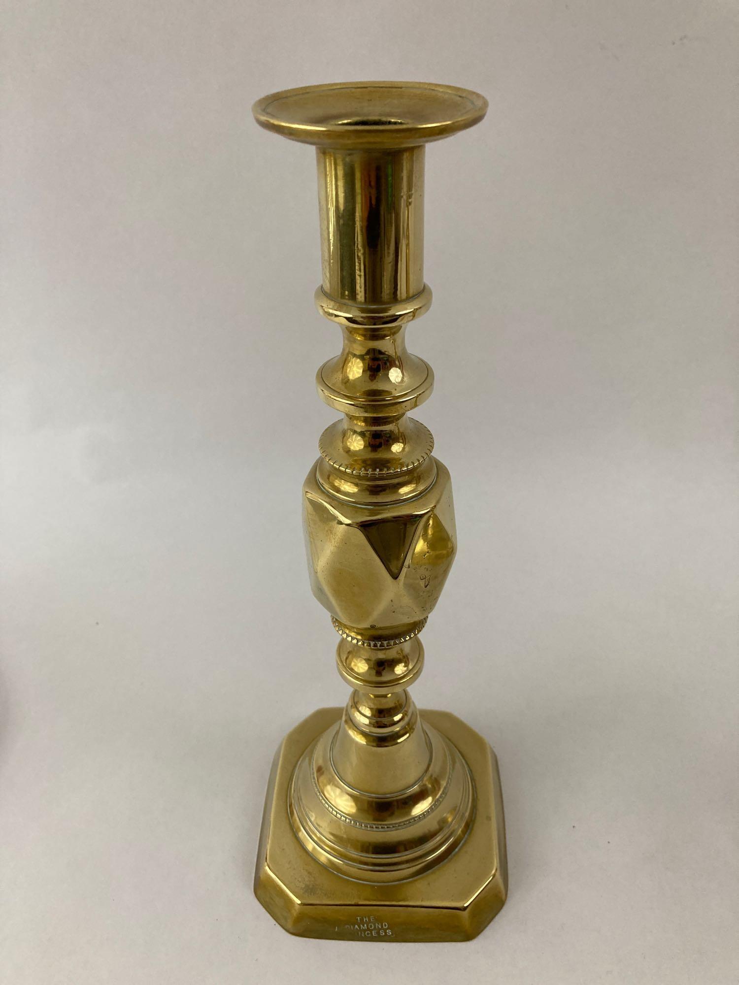 Pair of brass push up candle stick holders with hurricane globes