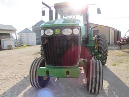 John Deere 7720 2wd 1899 hrs, 3 hyd, 20 speed power quad, 18.4-R42, weight rack, left hand reverser,