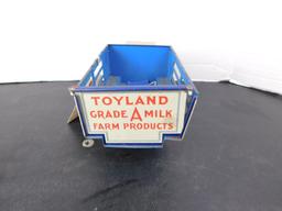 TOYLAND FARM PRODUCTS BALLOON CORD, GRADE A MILK, WIND-UP TIN TRUCK