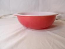 LARGER VINTAGE PINK PYREX HANDLED BOWL. SMALL CHIP MISSING UNDER ONE OF THE HANDLES. APPROX 9"