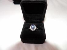 TANZANITE RING WITH DIAMOND HALO IN 14K WHITE GOLD. APPROX SIZE 8 AND APPROX 4.7 GRAMS