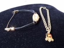 LOT OF (2) PIECES OF VINTAGE JEWELRY INCLUDING GOLD FILLED CHARM BRACELET W/ 10K CHARM AND LADIES