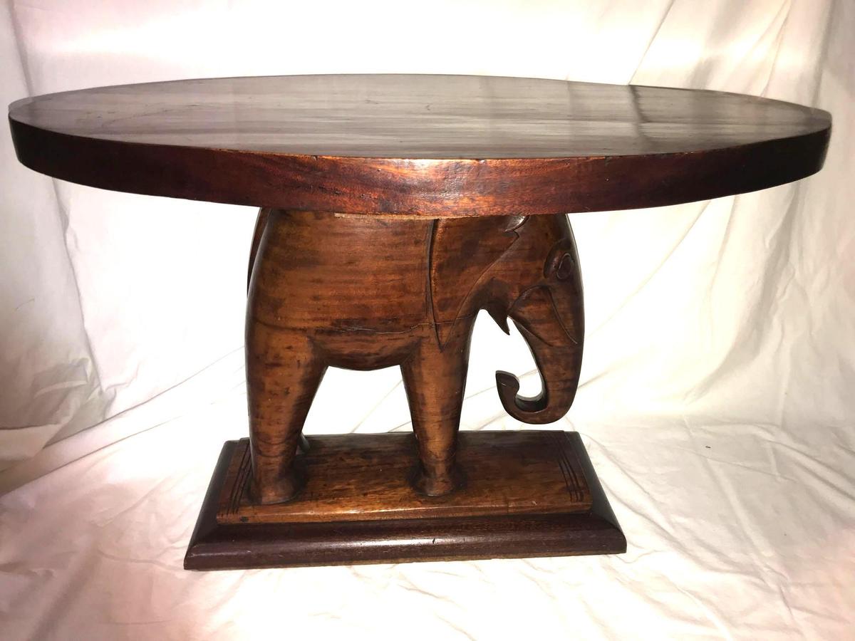 Unique carved Mahogany Elephant based table.