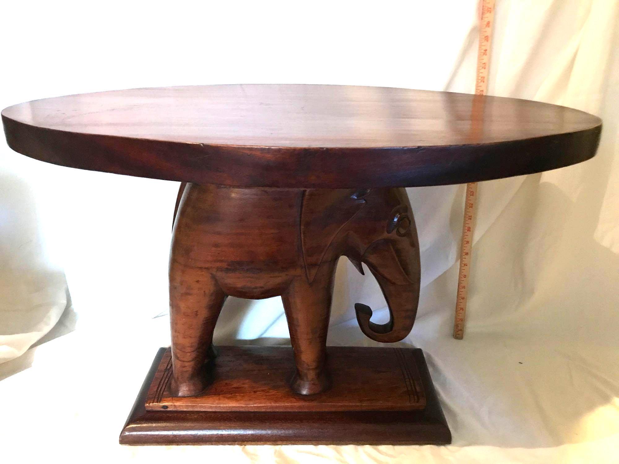 Unique carved Mahogany Elephant based table.