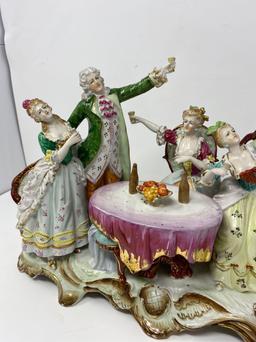 Porcelain Figural Grouping- People Toasting Around a Table