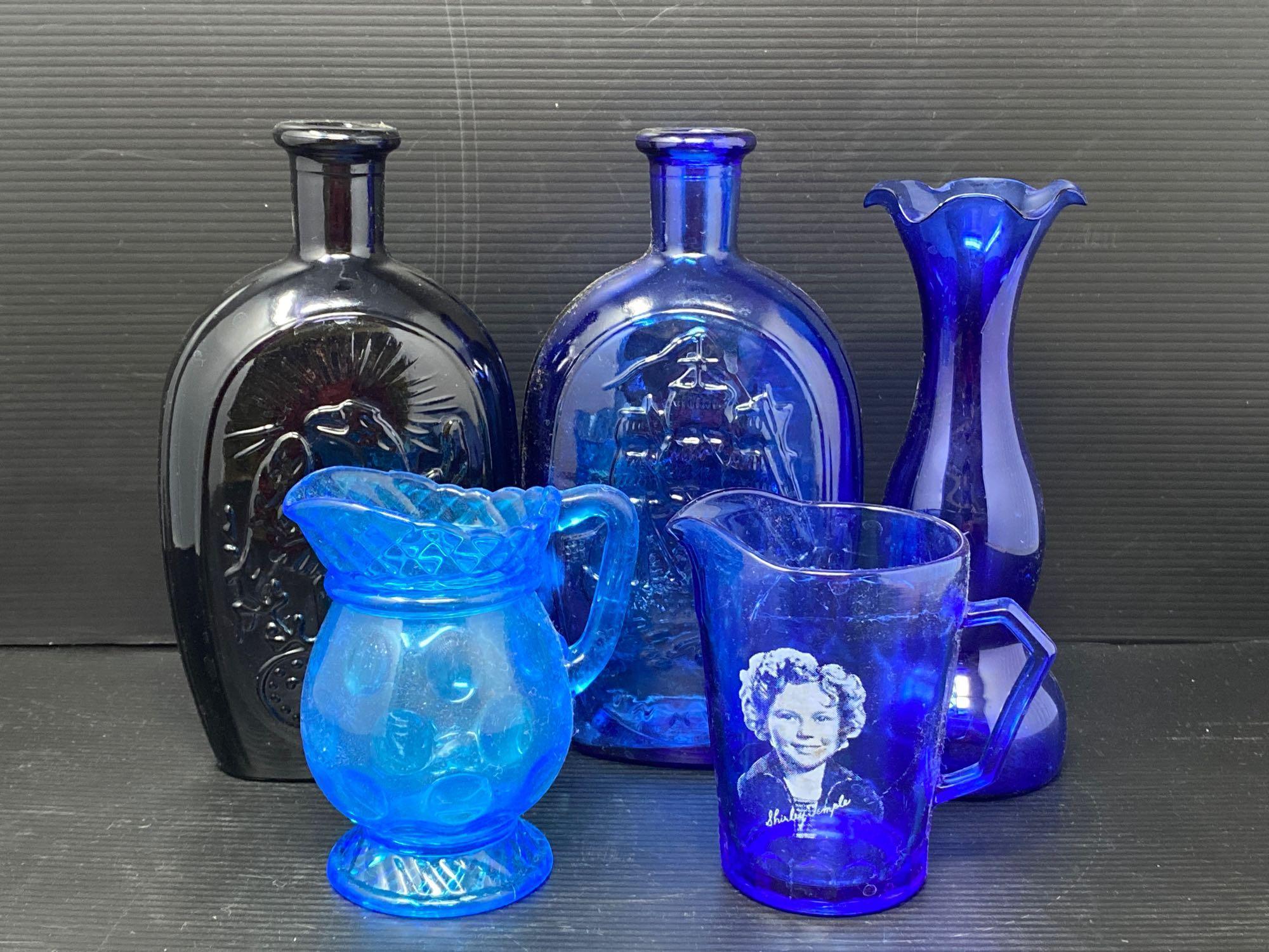 Blue Glass Lot- Includes Bottles, Vase and Creamers- One is Shirley Temple