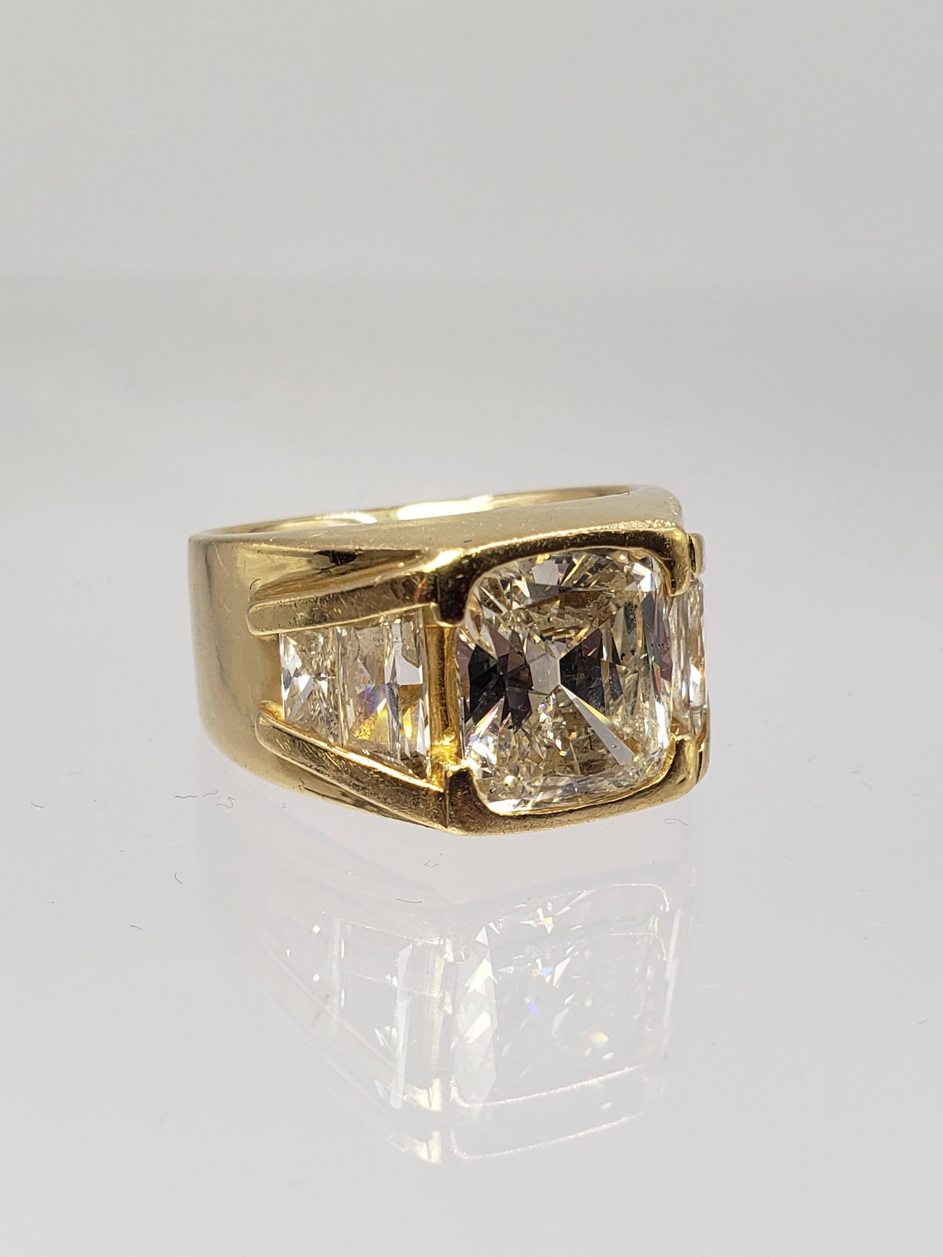 18KT YELLOW GOLD 5.06CT GIA CERTIFIED DIAMOND RING WITH TRAPEZOID CUT SIDE DIAMOND SETTING