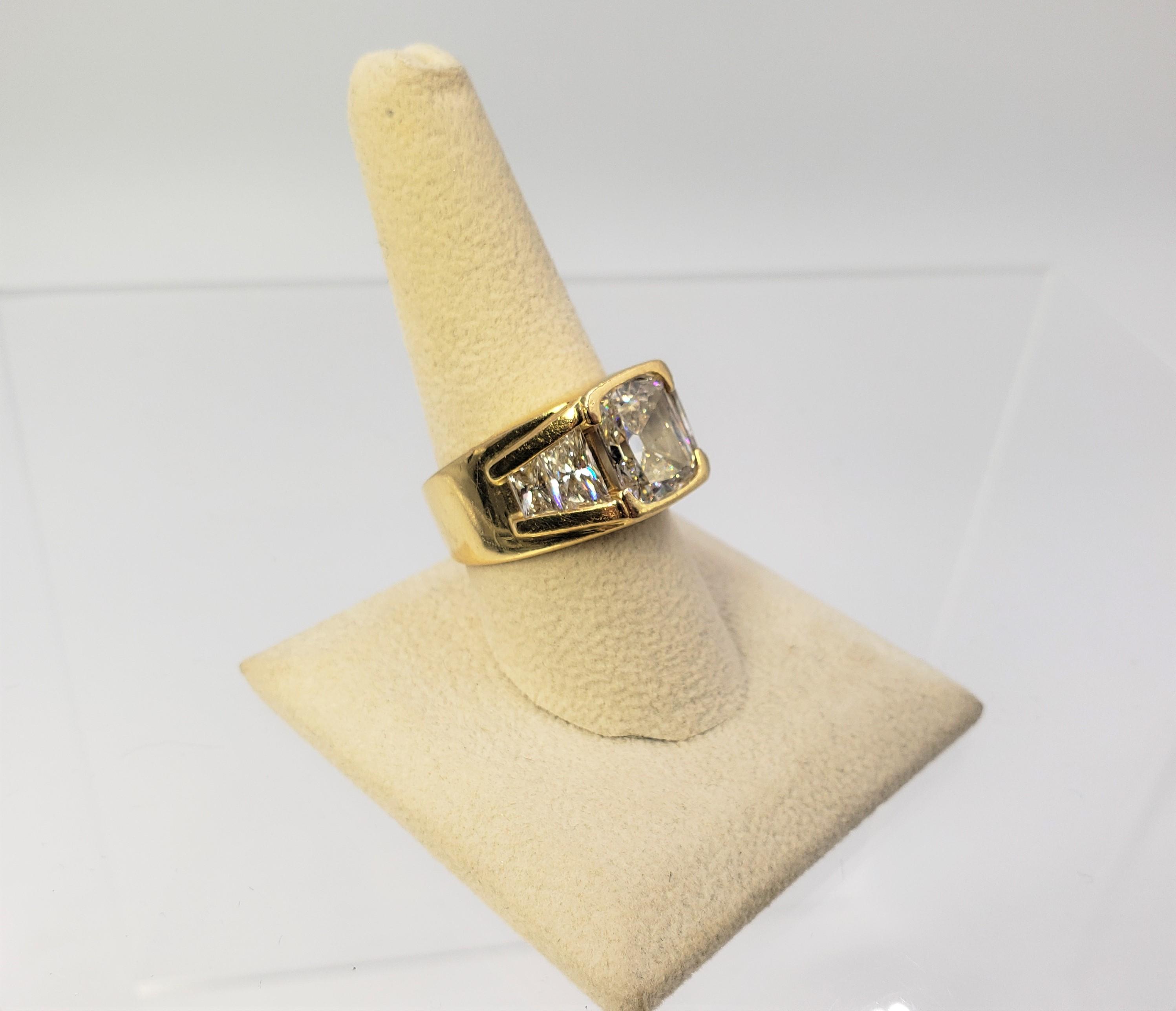 18KT YELLOW GOLD 5.06CT GIA CERTIFIED DIAMOND RING WITH TRAPEZOID CUT SIDE DIAMOND SETTING