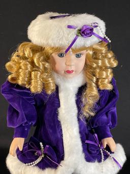 16" Porcelain doll in a purple velvet dress w/ matching coat & hat