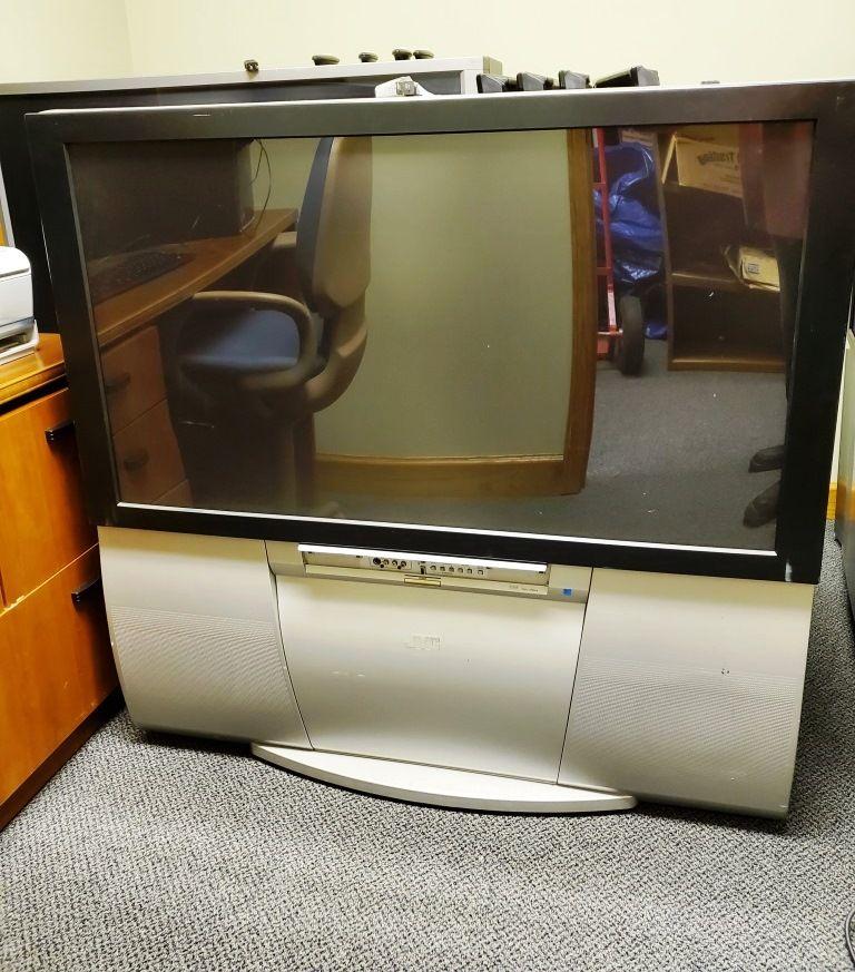 2 rear projection TVs