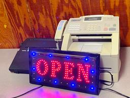 Typewriter, fax, and OPEN sign
