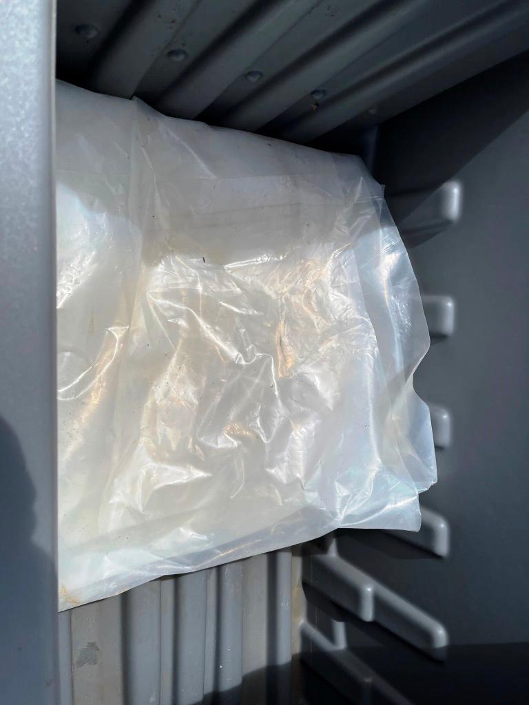 Garbage Dumpster and plastic sheeting