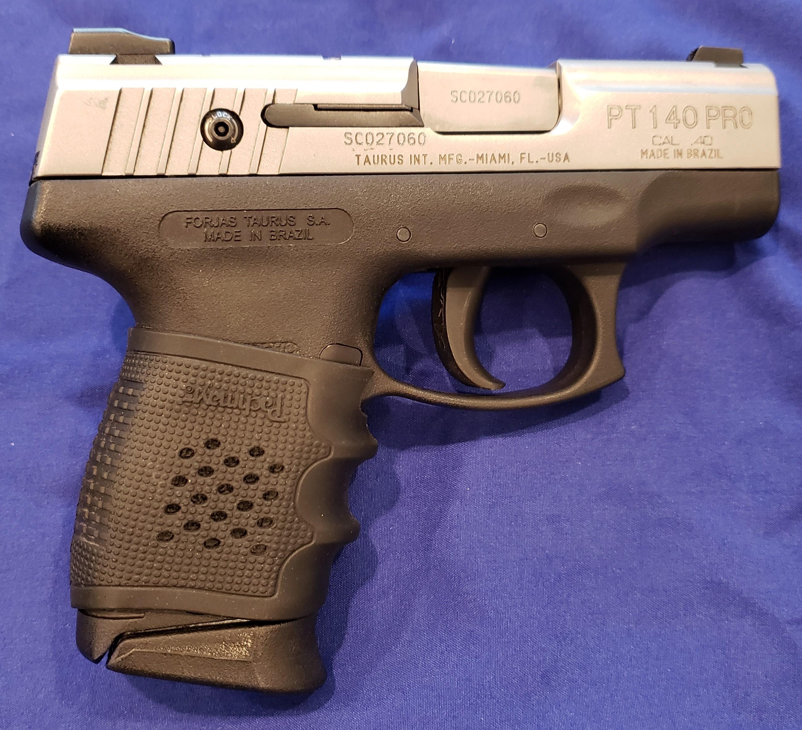 TAURUS MODEL PT140 PISTOL 40 S&W IN FACTORY BOX, AVERAGE CONDITION