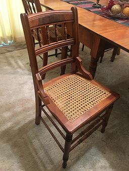 Walnut 40"x64" drop leaf table and six (6) Burl Walnut cane bottom chairs, nice condition