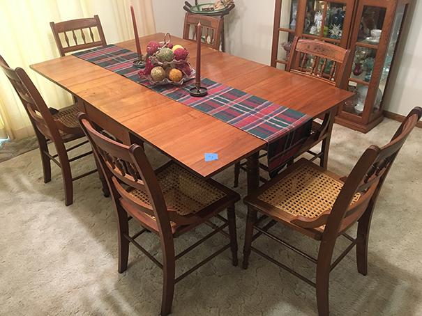 Walnut 40"x64" drop leaf table and six (6) Burl Walnut cane bottom chairs, nice condition