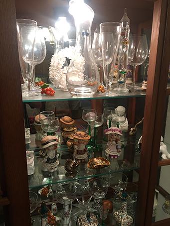 42" x 76" lighted curio cabinet with misc. dishes and figurines