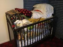 Various bedding, baby bed (needs attention)