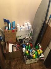 Various cleaning supplies, paper products, ironing board and iron, picture frames