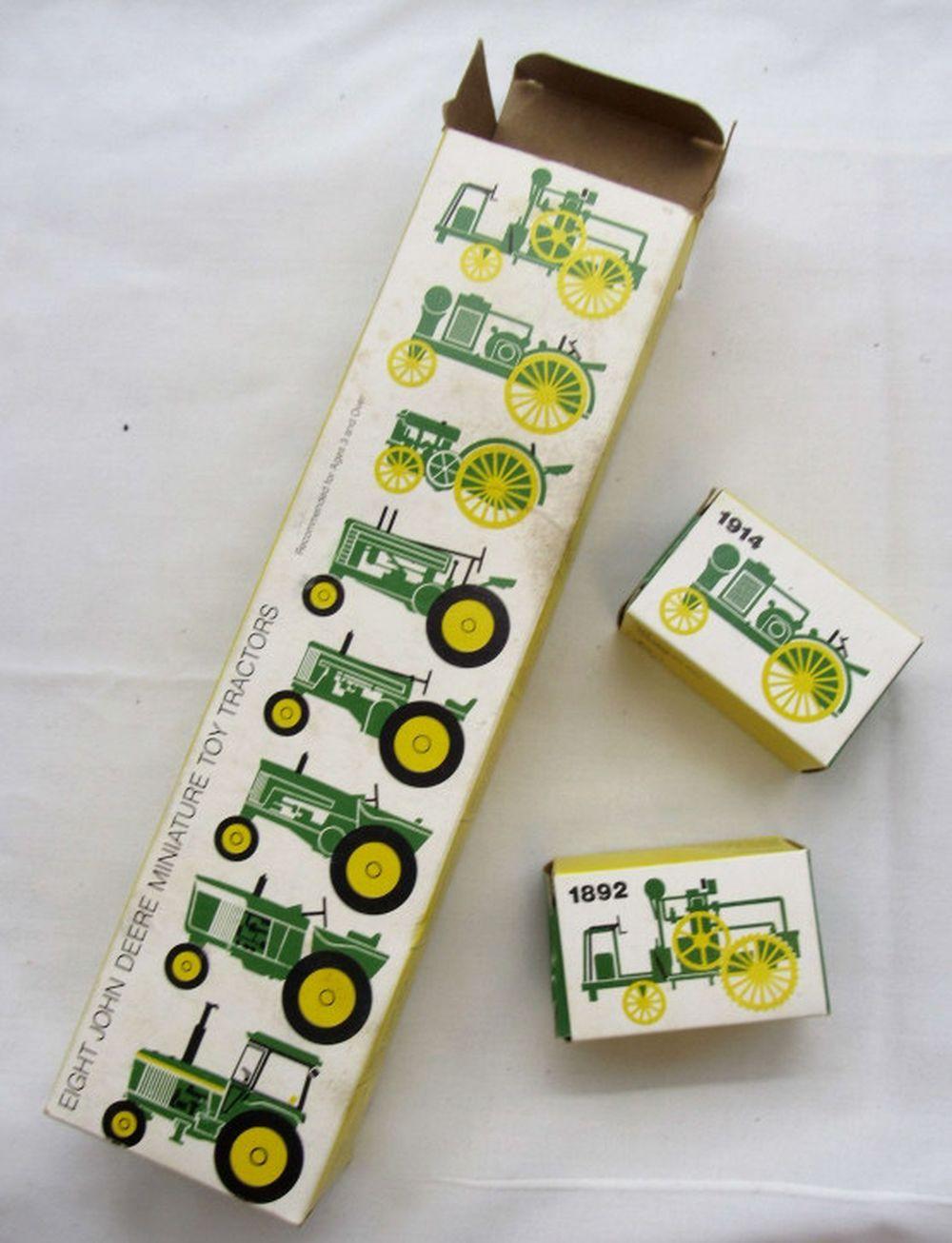Vintage "Eight John Deere Miniature Toy Tractors"