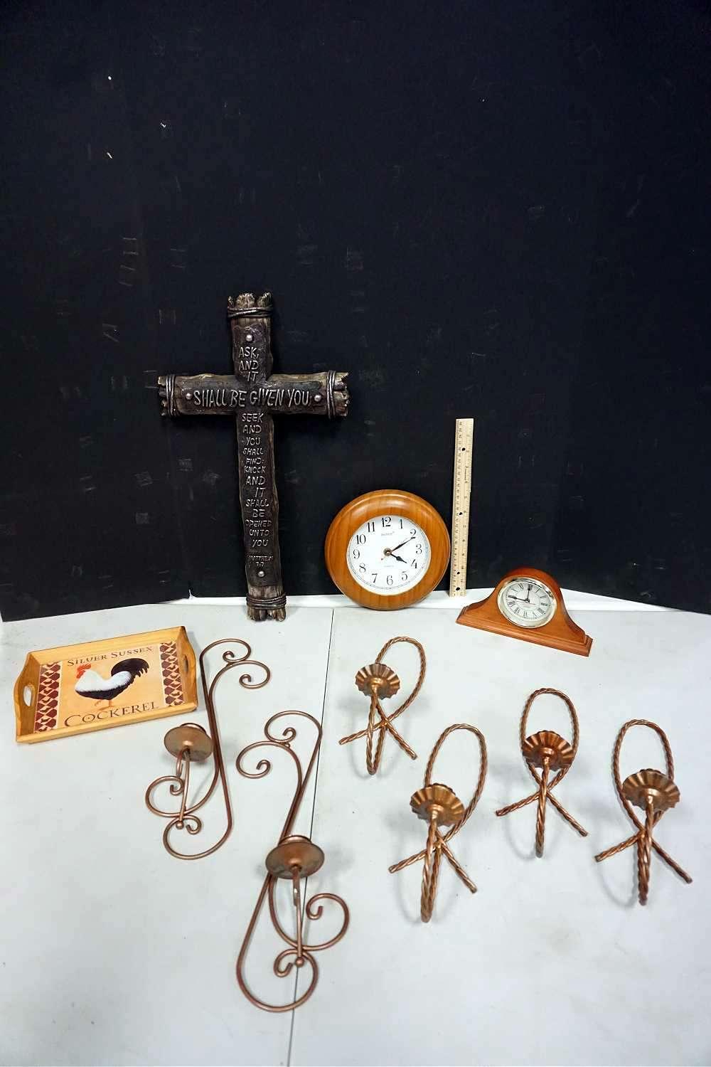 Candle holder, clocks, cross, tray.