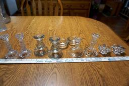 Assorted glass candle sticks.