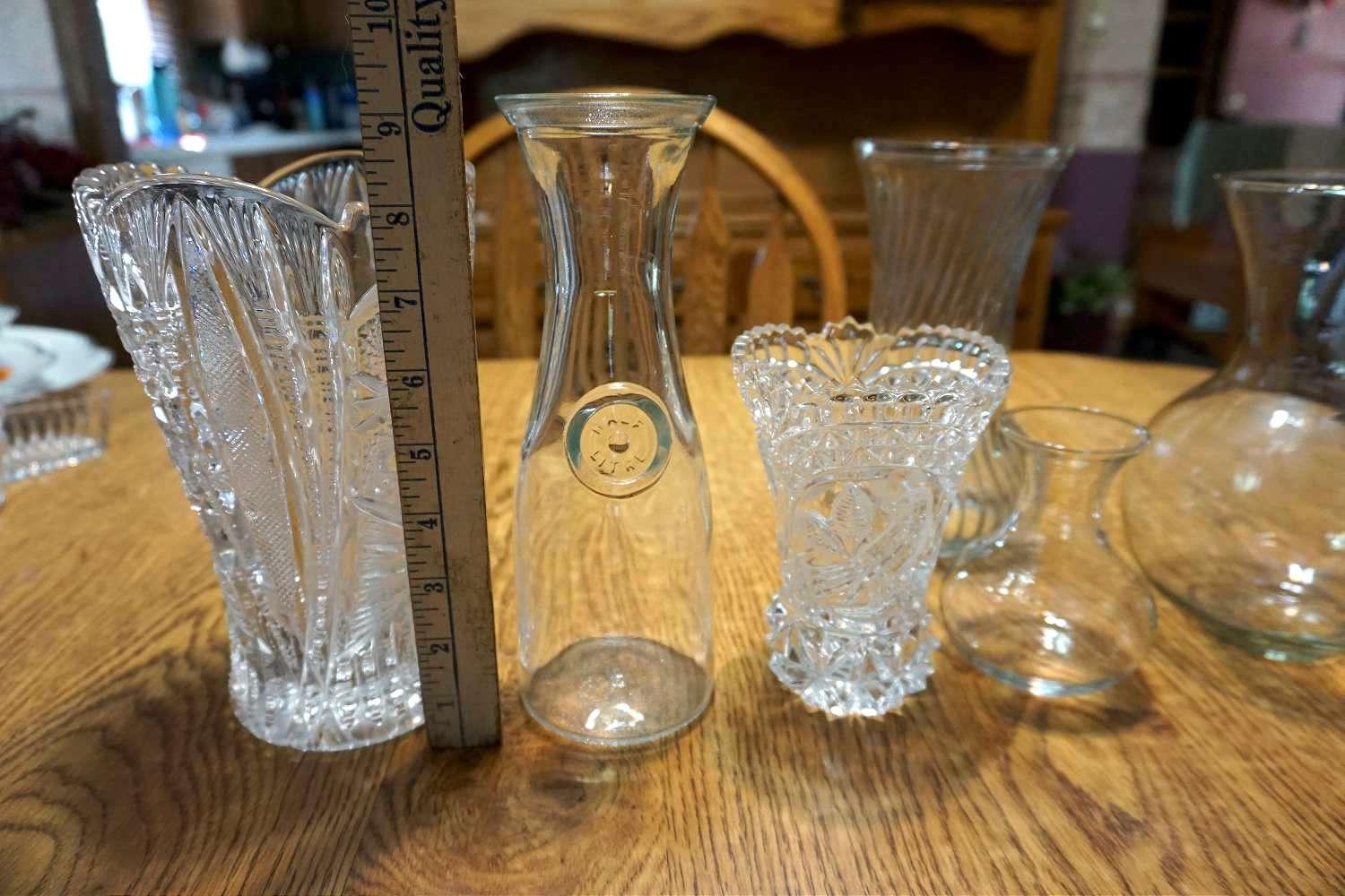 Assorted glass vases and milk Bottle.