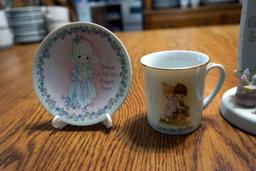 Assorted precious moments plates, cup, figurine.