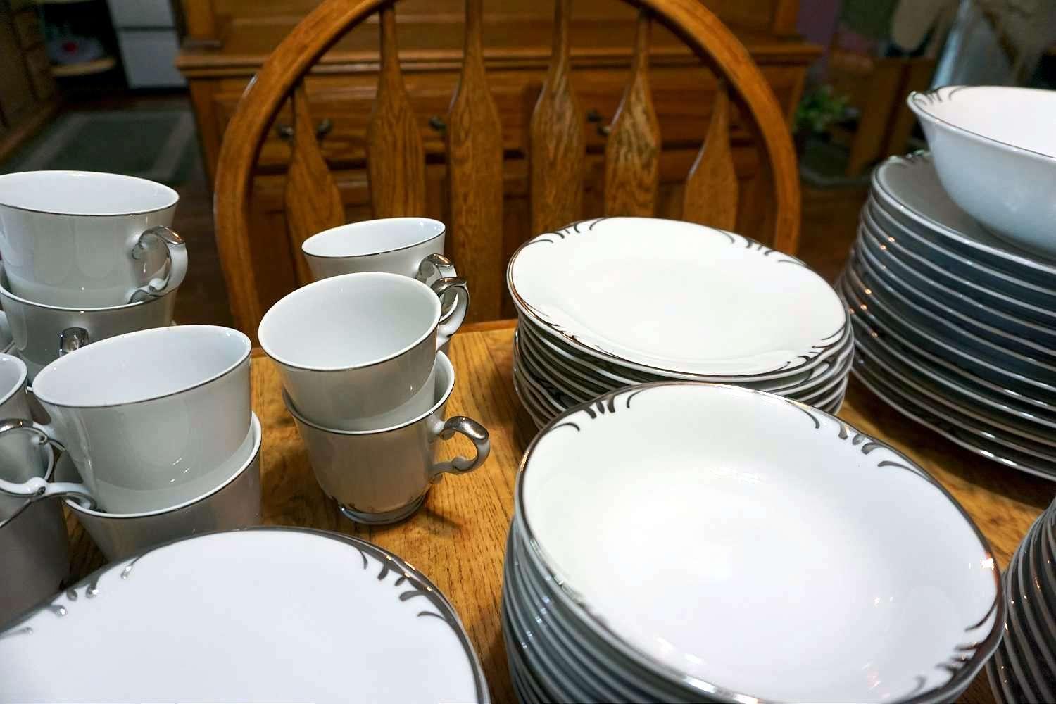 Large silver rimmed China set with serving pieces