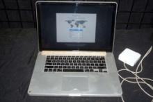 MacBook Pro Laptop w/ Charger (crack in mousepad)