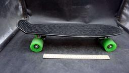 Black Skateboard W/ Green Wheels