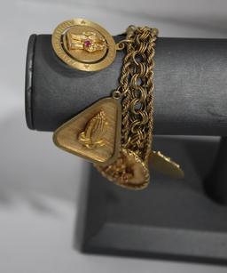 14K Gold Bracelet with 9 14K Charms 63.02g