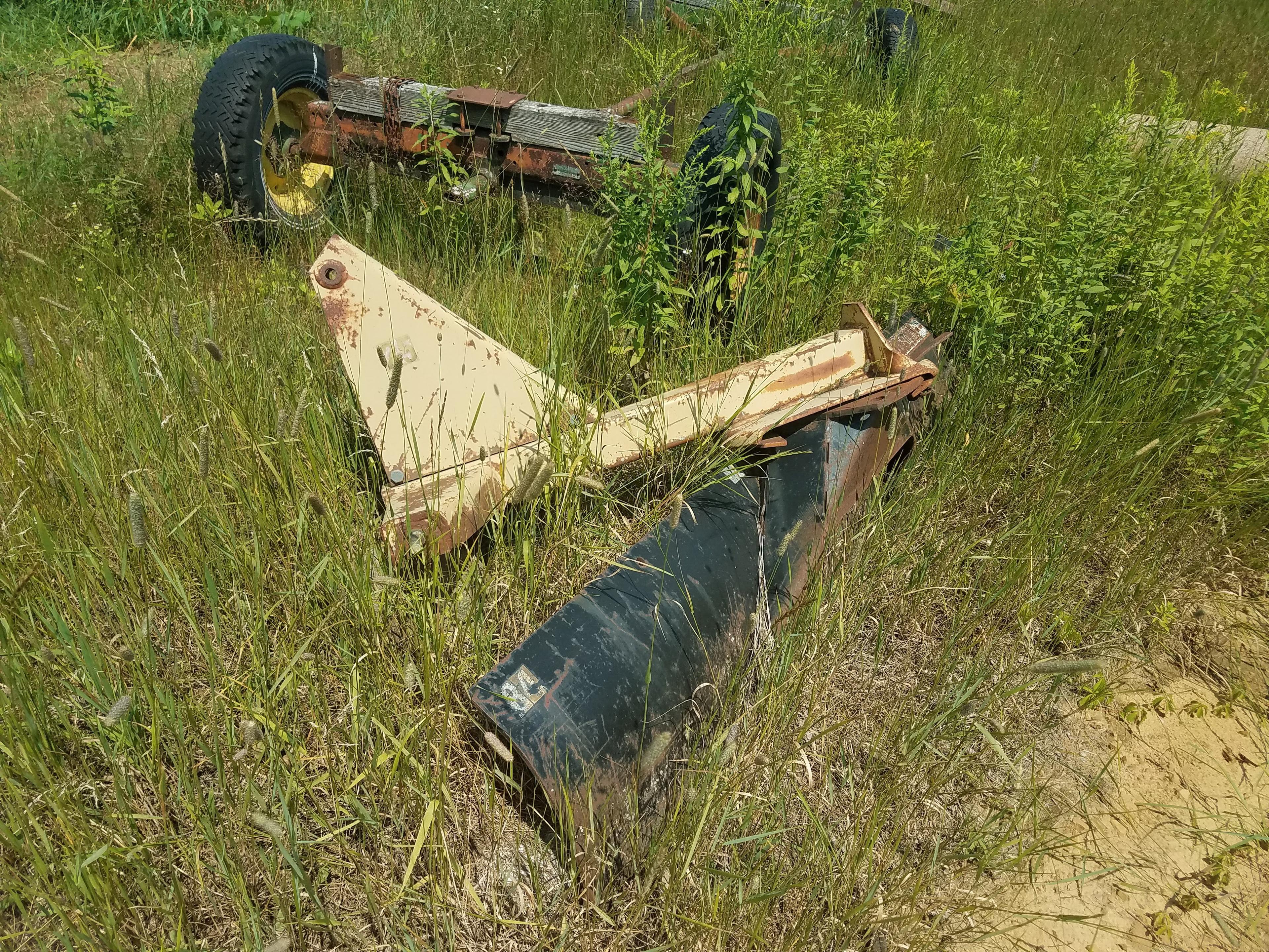 Large lot of misc equipment. Some for parts. 2 wooden fladbed hay racks. 84