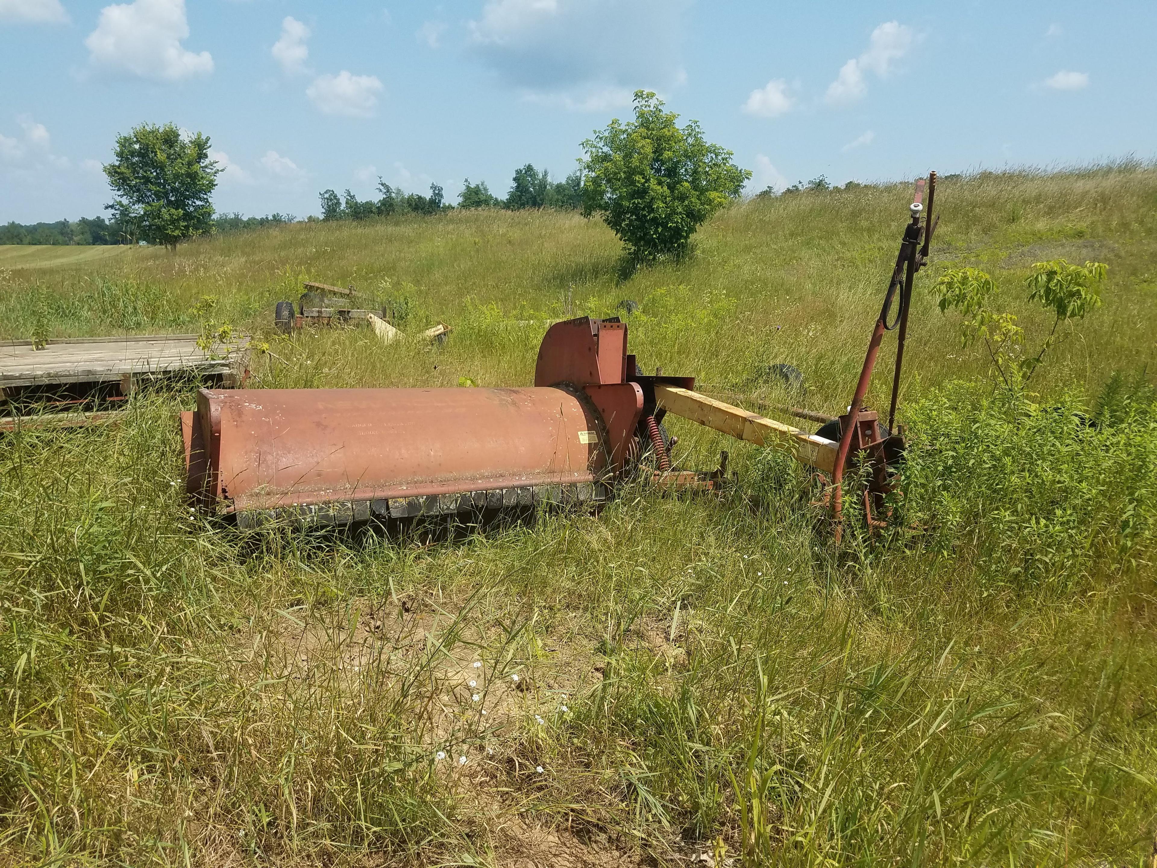 Large lot of misc equipment. Some for parts. 2 wooden fladbed hay racks. 84