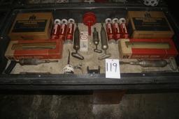 DISPLAY OF INTERNATIONAL GREASE GUNS AND GREASE