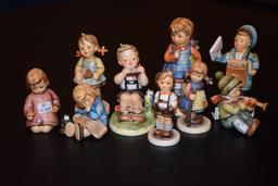 Nine small Hummel figurines seven with boxes