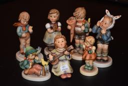 Tray lot of seven Hummel figurines