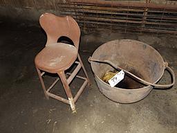 Old metal kettle, metal stool